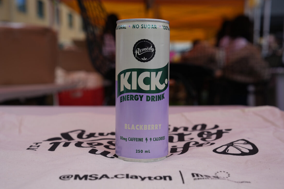 KICK energy drink sampled on an MSA tote bag at a campus event